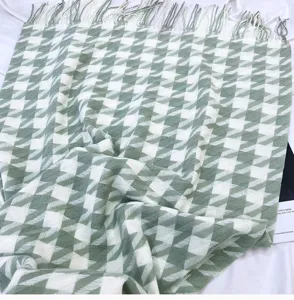Green and white houndstooth scarf with classic tassel design for warm winter daily wear.