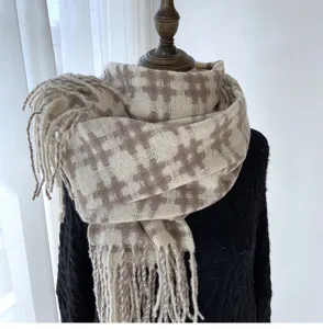Detail view of retro beige and brown plaid winter warm imitation cashmere scarf with tassels