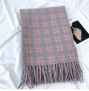 Grey pink plaid scarf detail, cozy cashmere-feel fabric with chic fringe, stylish winter accessory.
