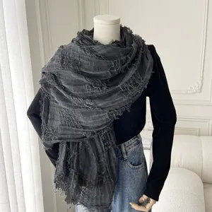 Dark grey fringe scarf detail view, lightweight shawl draped on mannequin for spring summer.