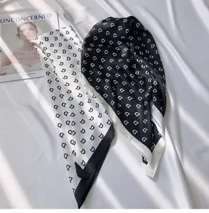 Chic black and white silk square scarf with letter D print, elegant fashion neckerchief for women.