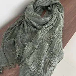 Detailed view of the crinkled gauze scarf, lightweight sun protection shawl for women summer.