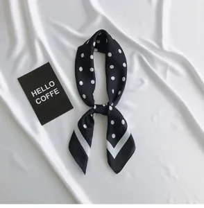 Black and white polka dot silk scarf detail view, elegant small neckerchief for women.