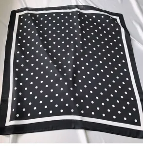Classic black and white polka dot square scarf with white border, elegant silk style.