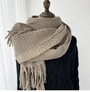 Stay warm and stylish with this cozy imitation cashmere scarf featuring elegant fringes.