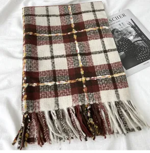 Cozy winter plaid scarf in rich brown tones with elegant fringe detail. Warm cashmere feel.