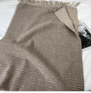 Cozy brown reversible tassel scarf detail shot, soft cashmere-feel winter shawl and wrap.