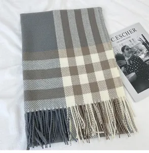 Detailed view of women's imitation cashmere plaid winter scarf with elegant fringe design.
