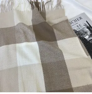 Cozy brown and beige plaid winter scarf with chic fringe details for daily warmth.