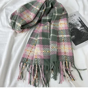 Cozy autumn winter plaid scarf detail with soft cashmere-like fabric and chic fringe.