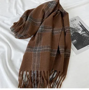Cozy brown plaid winter scarf with stylish fringe, warm and soft stylish fashion accessory.