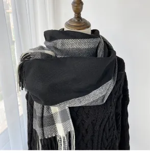 Cozy winter plaid scarf for women, classic black and grey tartan shawl with stylish fringes.