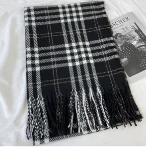Classic black and white plaid scarf detail, soft tassel trim, cozy winter accessory.