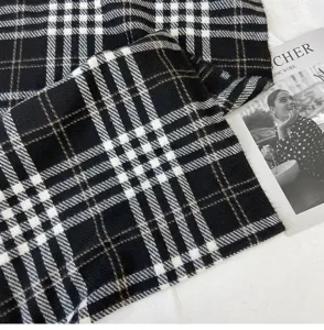 Detailed view of classic black and white plaid pattern winter warm imitation cashmere scarf.