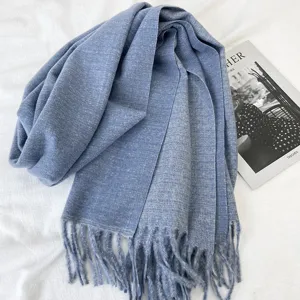 Classic blue cashmere-feel winter scarf with elegant fringe details for women warm fashion.