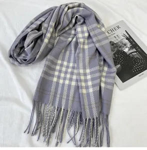 Purple plaid scarf detail showcasing soft imitation cashmere fabric texture and classic fringed hems.