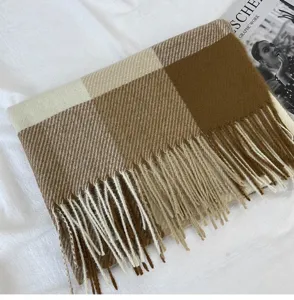 Cozy brown plaid winter scarf with soft fringes, thick warm fabric for cold weather daily wear.