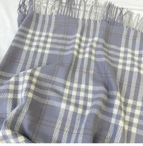 Cozy cashmere-feel plaid winter scarf detail, soft fringe and classic british check design.