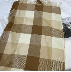 Brown and beige plaid winter scarf with cozy fringe detail, warm and stylish soft accessory.