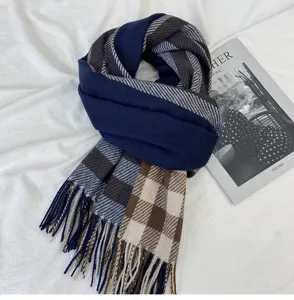 Fall winter cozy plaid tassel scarf close up detailed view soft imitation cashmere fabric.