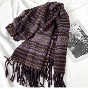 Close-up of the soft brown and purple striped scarf with detailed texture and classic tassels.