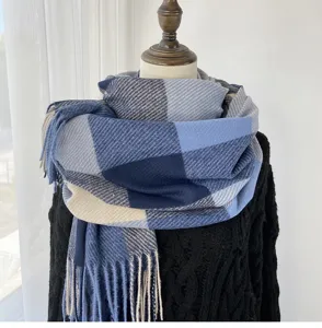 Blue and grey plaid winter scarf detail, soft fringe tassel design, cozy warm neck wrap accessory.