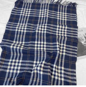 Classic navy blue plaid scarf with fringe, cozy winter warm tartan shawl accessory.