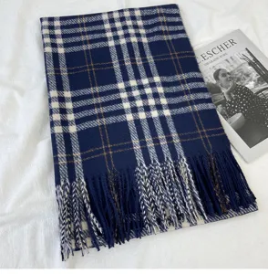 Classic plaid scarf detail shot, cozy cashmere-feel winter shawl, stylish navy blue design.