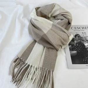 Classic plaid winter scarf with cozy fringe, warm and stylish brown and beige design.
