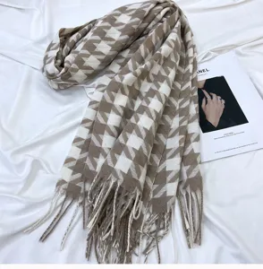 Cozy brown and white houndstooth scarf with classic fringe design for winter daily warmth.