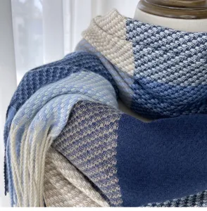 Detailed view of women autumn winter plaid imitation cashmere scarf with cozy tassels.