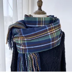 Detailed view of the winter tartan plaid scarf featuring cozy tassel hem and classic pattern.