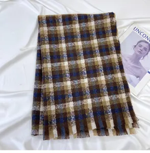 Retro plaid winter scarf detail, soft imitation cashmere fabric, elegant blue and brown tartan.