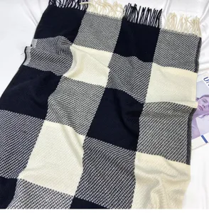 Autumn winter classic black white grid scarf soft imitation cashmere tassel shawl detail view.