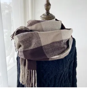 Cozy winter imitation cashmere scarf featuring a classic large brown plaid design with fringe.