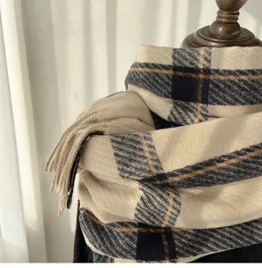 Classic plaid cashmere-feel winter scarf with fringe detail, cozy neckerchief for cold days.