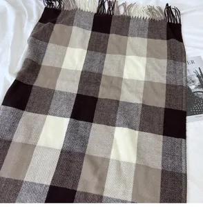 Close-up detail of the vintage brown and beige plaid cashmere-feel fringe scarf shawl.