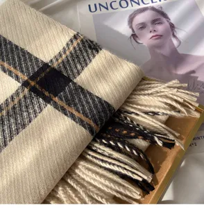 Cozy winter plaid cashmere-feel scarf with delicate fringe detail, soft and warm accessory.