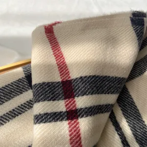 Close-up detail shot of the classic plaid imitation cashmere scarf showing soft texture.