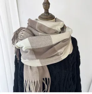 Detailed view of womens large plaid cashmere feel winter tassel scarf in neutral colors