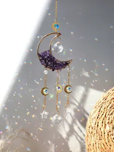Stunning crystal suncatcher featuring a gold moon frame with natural amethyst chips and prisms.