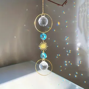 Crystal suncatcher hanging ornament with prisms, golden rings and sun motif for home decor.