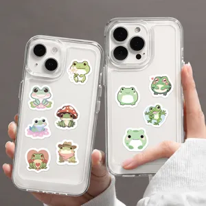 Clear phone case detail showcasing cute cartoon frog stickers design, transparent back cover.