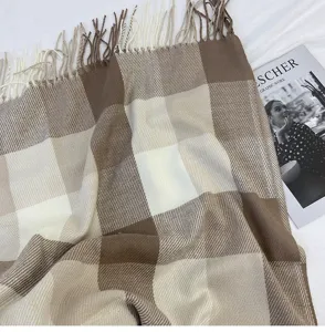 Cozy brown plaid cashmere-feel scarf with vintage fringe for women and winter fashion daily style.
