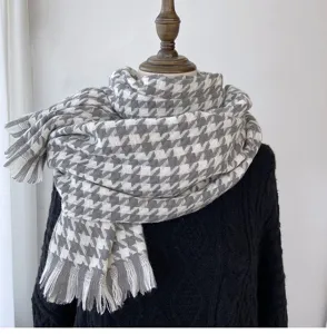 Houndstooth winter scarf detail, soft cashmere feel fabric, classic fringe hem and cozy warmth.