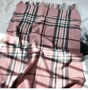 Pink plaid cashmere-feel winter scarf with elegant fringe detail, cozy shawl and wrap design.