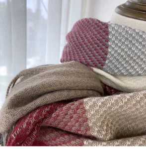 Detailed view of winter women's plaid tassel scarf featuring soft imitation cashmere fabric.