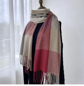 Detailed view of the stylish women's plaid cashmere-feel winter scarf with elegant fringe tassels.