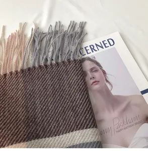 Cozy winter women's plaid tassel scarf, soft imitation cashmere scarf for daily warmth.