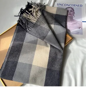 Cozy black and grey plaid cashmere-feel scarf with chic fringes for women winter warmth.